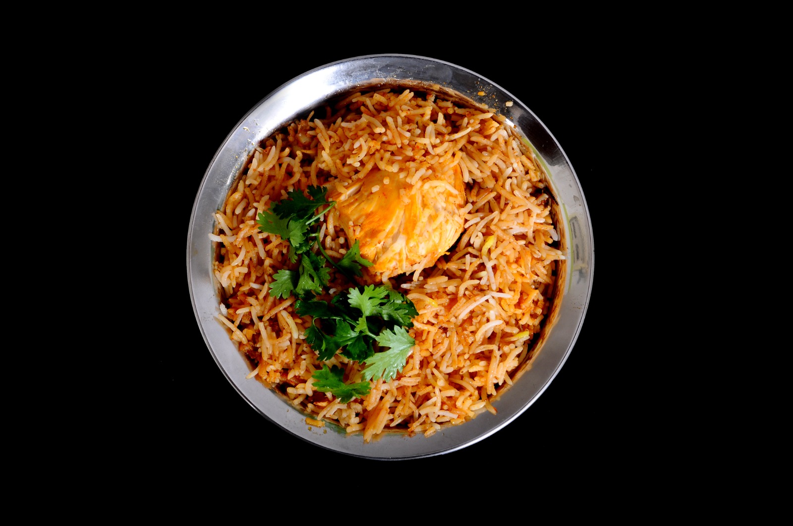 Veg Hyderabadi Dum Biryani, top-down with vegetables and fresh coriander